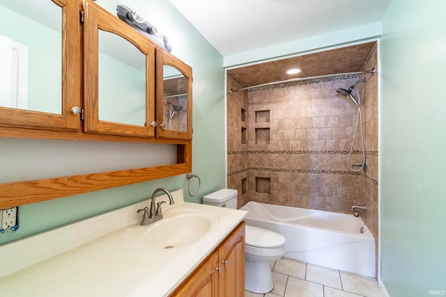 full bathroom with vanity, tiled shower / bath combo, toilet, and tile patterned flooring