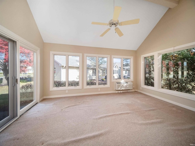 unfurnished sunroom with lofted ceiling, ceiling fan, a wall mounted air conditioner, and plenty of natural light