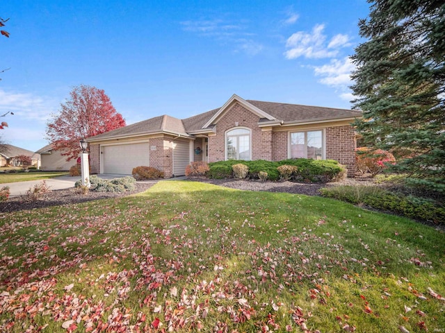 single story home with a front yard and a garage