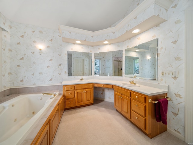 bathroom with vanity, a tub to relax in, and crown molding