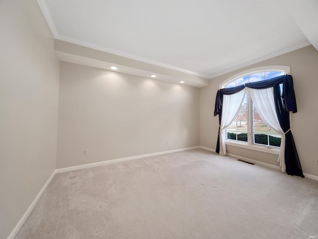 carpeted spare room with crown molding