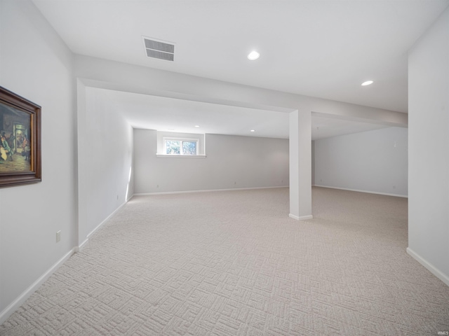 basement with light colored carpet