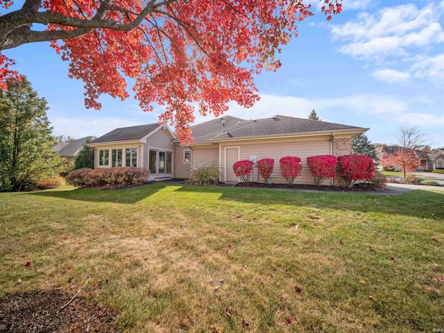 ranch-style home with a front yard