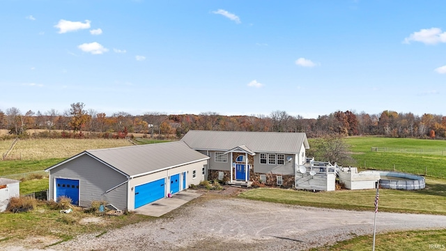 view of front of house with a front yard and a garage