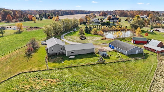 drone / aerial view with a water view and a rural view