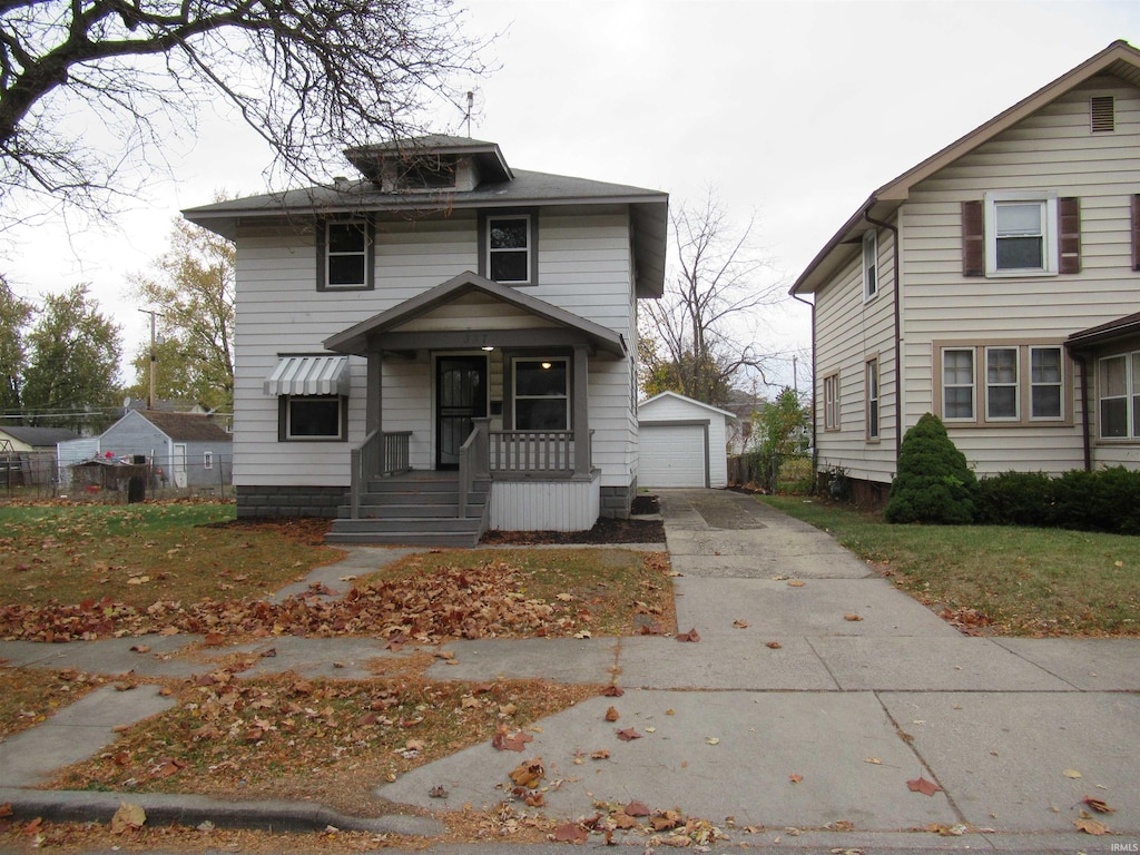 front facade with an outbuilding and a garage