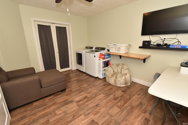 interior space with hardwood / wood-style floors, a textured ceiling, washing machine and clothes dryer, and ceiling fan