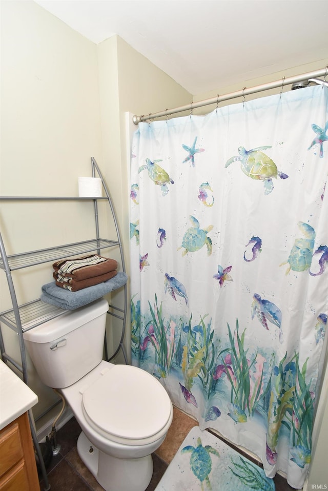 bathroom with vanity, toilet, tile patterned floors, and a shower with curtain