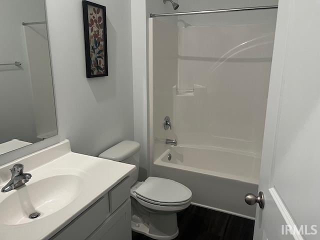 full bathroom featuring toilet, bathtub / shower combination, and vanity