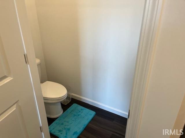 bathroom featuring toilet and hardwood / wood-style floors