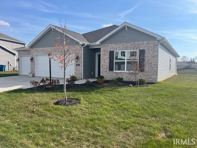 view of front of house with a front lawn and a garage