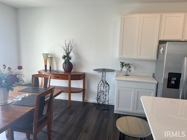 dining space featuring dark hardwood / wood-style flooring