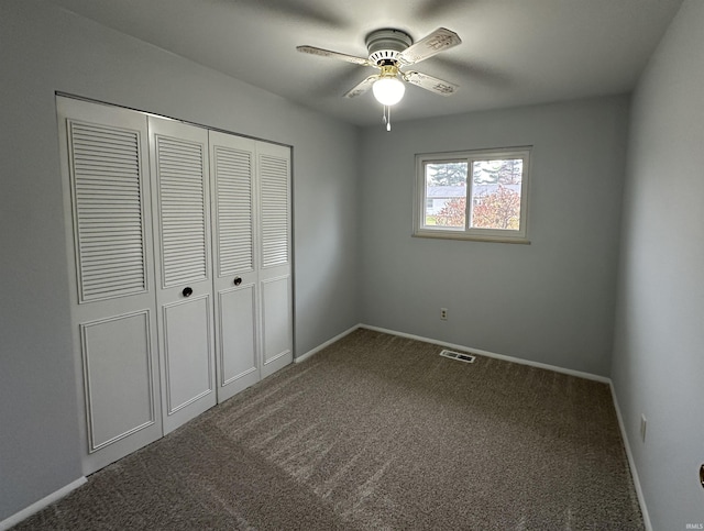 unfurnished bedroom featuring a closet, ceiling fan, and carpet flooring