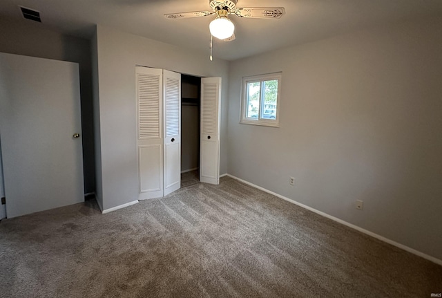 unfurnished bedroom with a closet, carpet, and ceiling fan