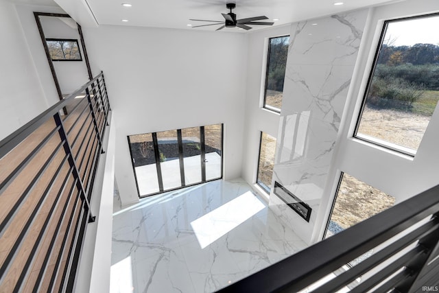 interior space with a healthy amount of sunlight and ceiling fan