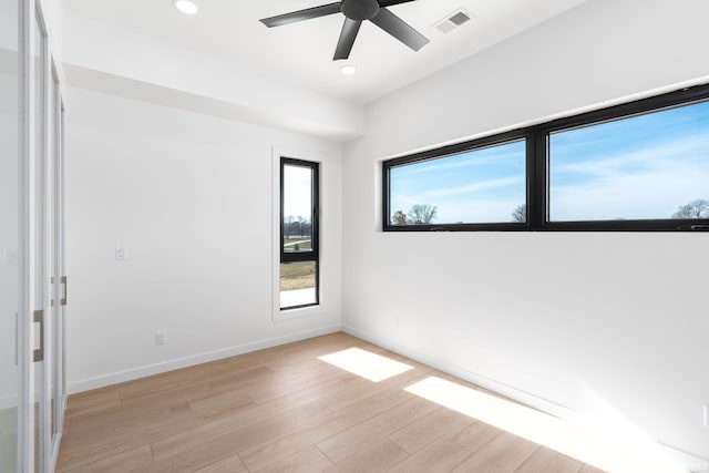 spare room with ceiling fan and light hardwood / wood-style flooring