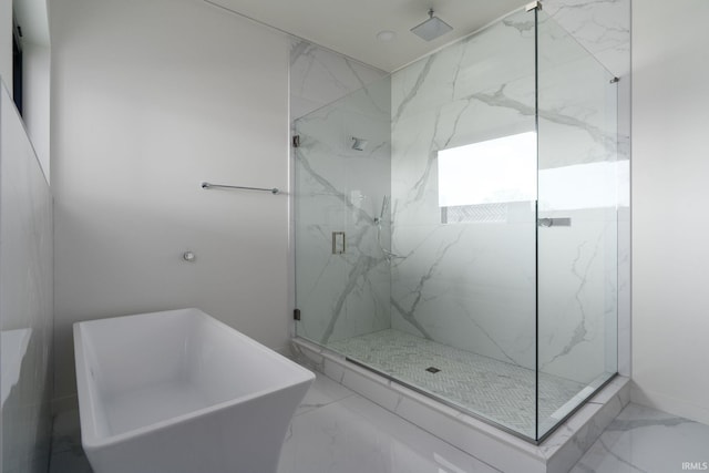 bathroom with shower with separate bathtub