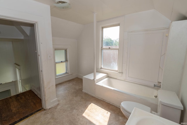 1815 Elwood Ave, South Bend, IN 46628 - full bath with lofted ceiling, toilet, and a tub to relax in