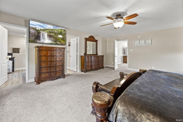 bedroom with light carpet, a textured ceiling, and ceiling fan