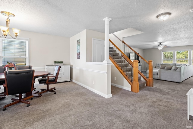 home office featuring a textured ceiling, ornate columns, and light colored carpet