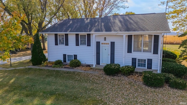 split foyer home with a front lawn