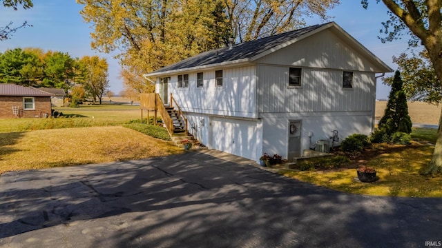 view of side of home featuring a garage