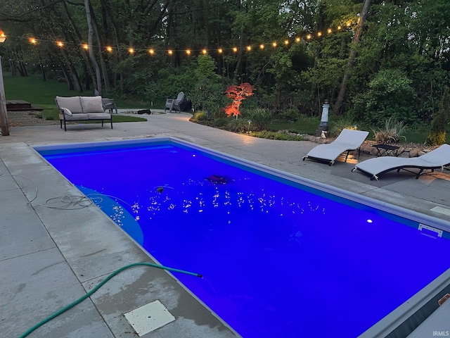 view of swimming pool featuring a patio area and an outdoor hangout area