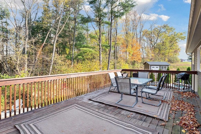 313 Tiger Ct, New Carlisle, IN 46552 - deck with outdoor dining area and area for grilling