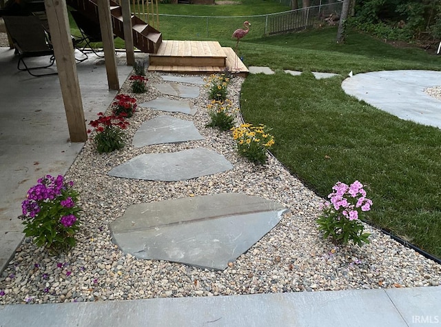 view of yard with a patio and a wooden deck