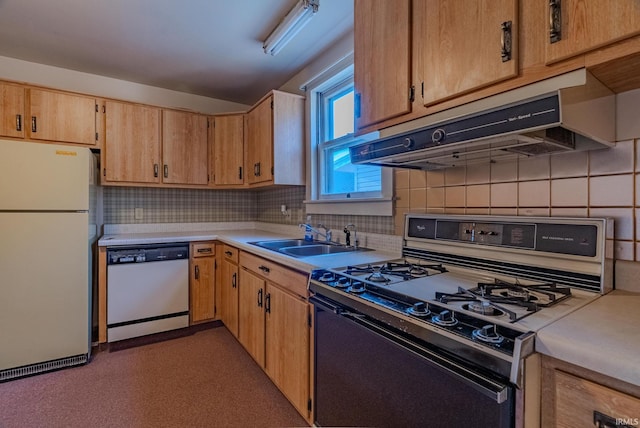 kitchen with sink, appliances with stainless steel finishes, and backsplash