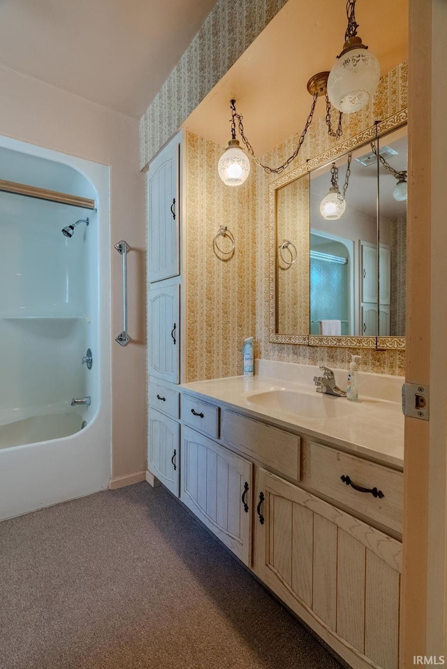 bathroom featuring vanity and bathing tub / shower combination