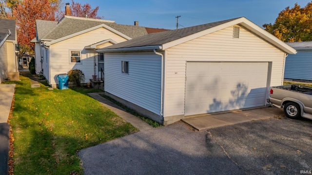 garage featuring a yard