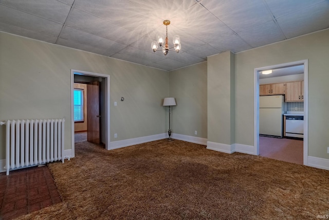 unfurnished room featuring carpet, a notable chandelier, and radiator heating unit