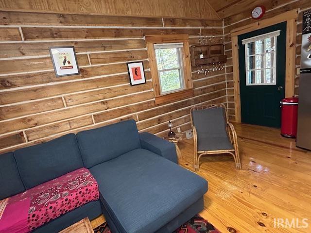 3210 Cedar Gap Ln, Birdseye, IN 47513 - sitting room with wooden walls, wood finished floors, and lofted ceiling