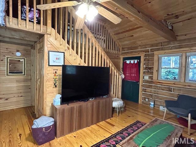 3210 Cedar Gap Ln, Birdseye, IN 47513 - living area with wooden walls, hardwood / wood-style flooring, a ceiling fan, wooden ceiling, and stairs