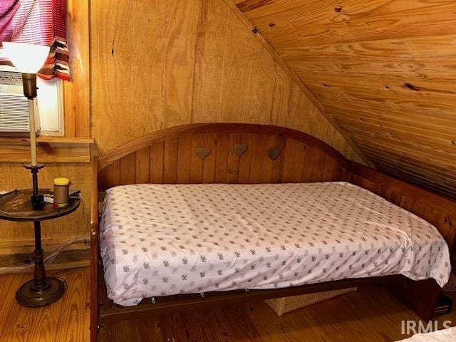 3210 Cedar Gap Ln, Birdseye, IN 47513 - bedroom featuring vaulted ceiling, wood finished floors, and wood walls