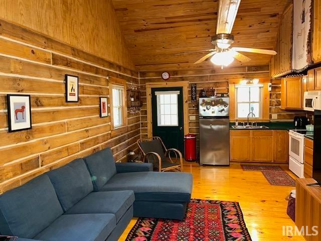 living room featuring light hardwood / wood-style floors, sink, plenty of natural light, and ceiling fan