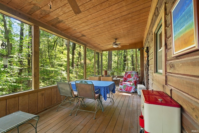 wooden terrace featuring ceiling fan