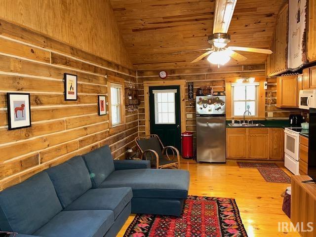 3210 Cedar Gap Ln, Birdseye, IN 47513 - living room featuring wooden ceiling, light wood finished floors, healthy amount of natural light, wood walls, and a ceiling fan