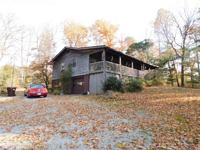 view of side of home with a garage