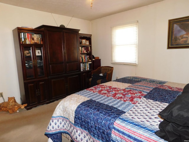 bedroom featuring light carpet