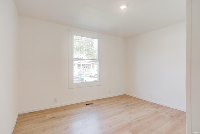 unfurnished room with light hardwood / wood-style floors