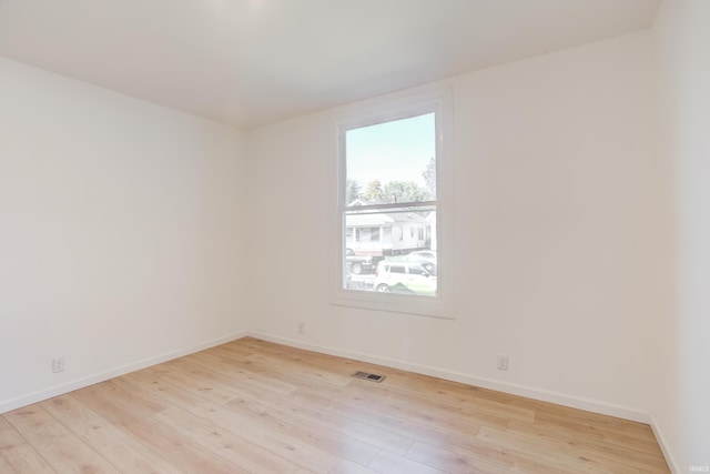 unfurnished room featuring light hardwood / wood-style flooring