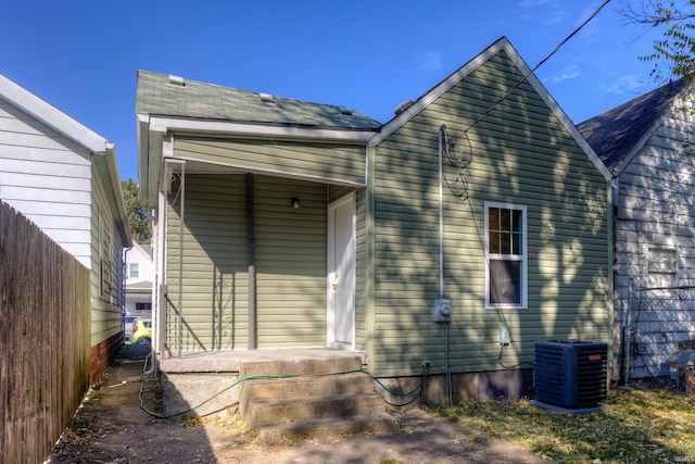 back of property featuring central AC