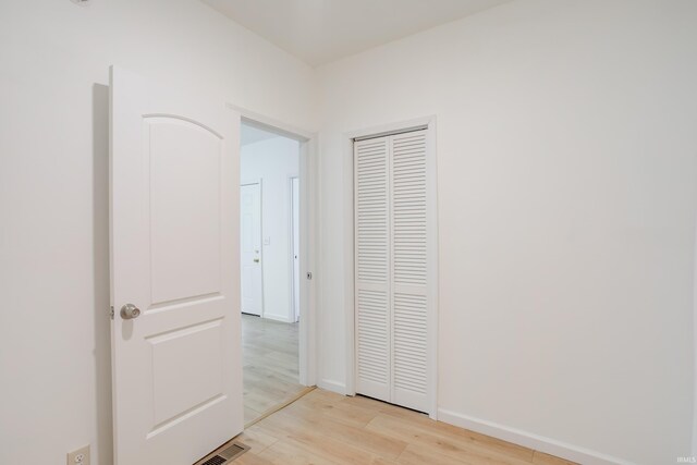 hallway featuring light hardwood / wood-style flooring