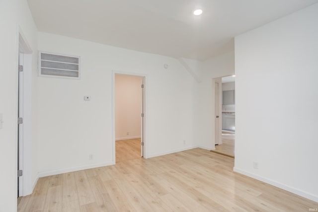 empty room with light hardwood / wood-style floors