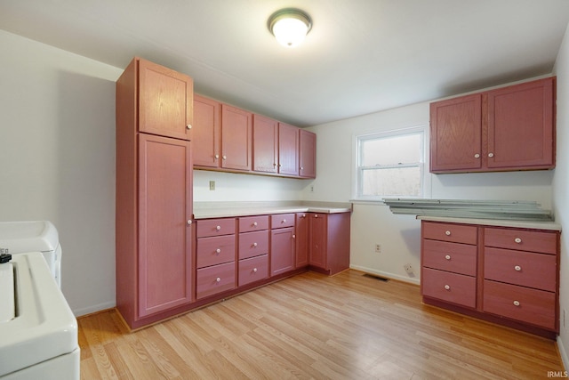 kitchen featuring light hardwood / wood-style floors and washer / clothes dryer