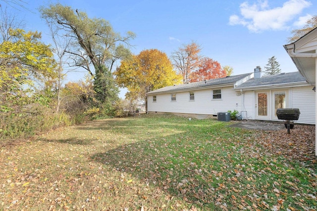 view of yard featuring a patio area and central AC unit