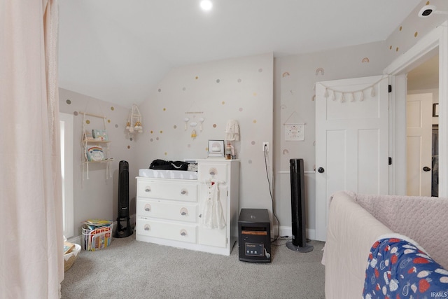 bedroom featuring lofted ceiling and light colored carpet