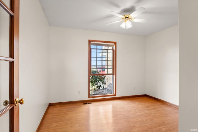 unfurnished room with light hardwood / wood-style floors and ceiling fan